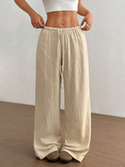 Women's linen wide leg pants featuring an adjustable drawstring, designed for casual lightweight comfort, perfect for summer outings. 1