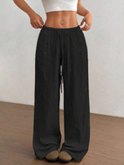 Women's linen wide leg pants featuring an adjustable drawstring, designed for casual lightweight comfort, perfect for summer outings. 2