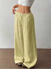 Women's linen wide leg pants featuring an adjustable drawstring, designed for casual lightweight comfort, perfect for summer outings. 3