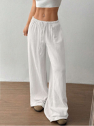 Women's linen wide leg pants featuring an adjustable drawstring, designed for casual lightweight comfort, perfect for summer outings. 5