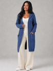Women's long cardigan sweater featuring a cozy hood and functional pockets, designed with a chunky cable knit pattern and an open front for a stylish and comfortable look. 2