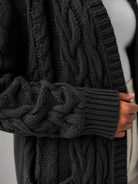 Women's long cardigan sweater featuring a cozy hood and functional pockets, designed with a chunky cable knit pattern and an open front for a stylish and comfortable look. 4