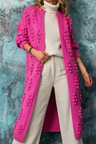 Women's long cardigan featuring a cozy open front design, stylish bobble knit texture, and practical pockets, available in eight vibrant colors. 1