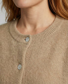 Women's long black cardigan featuring a button front design, crafted from soft brushed knit for comfort and style. 4
