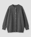 Women's long black cardigan featuring a button front design, crafted from soft brushed knit for comfort and style. 8