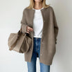 Women's long black cardigan featuring a button front and round neck, perfect for cozy layering in any season. 4