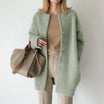 Women's long black cardigan featuring a button front and round neck, perfect for cozy layering in any season. 5