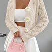 Elegant white women's long cardigan featuring an open crochet design and decorative floral buttons, perfect for layering in any season. 11