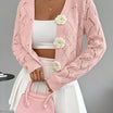 Elegant white women's long cardigan featuring an open crochet design and decorative floral buttons, perfect for layering in any season. 12