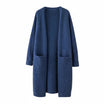 Women's long black cardigan with pockets, featuring a soft knit fabric and relaxed fit, perfect for layering and casual wear. 1