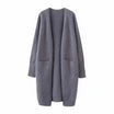 Women's long black cardigan with pockets, featuring a soft knit fabric and relaxed fit, perfect for layering and casual wear. 2