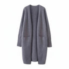 Women's long black cardigan with pockets, featuring a soft knit fabric and relaxed fit, perfect for layering and casual wear. 2