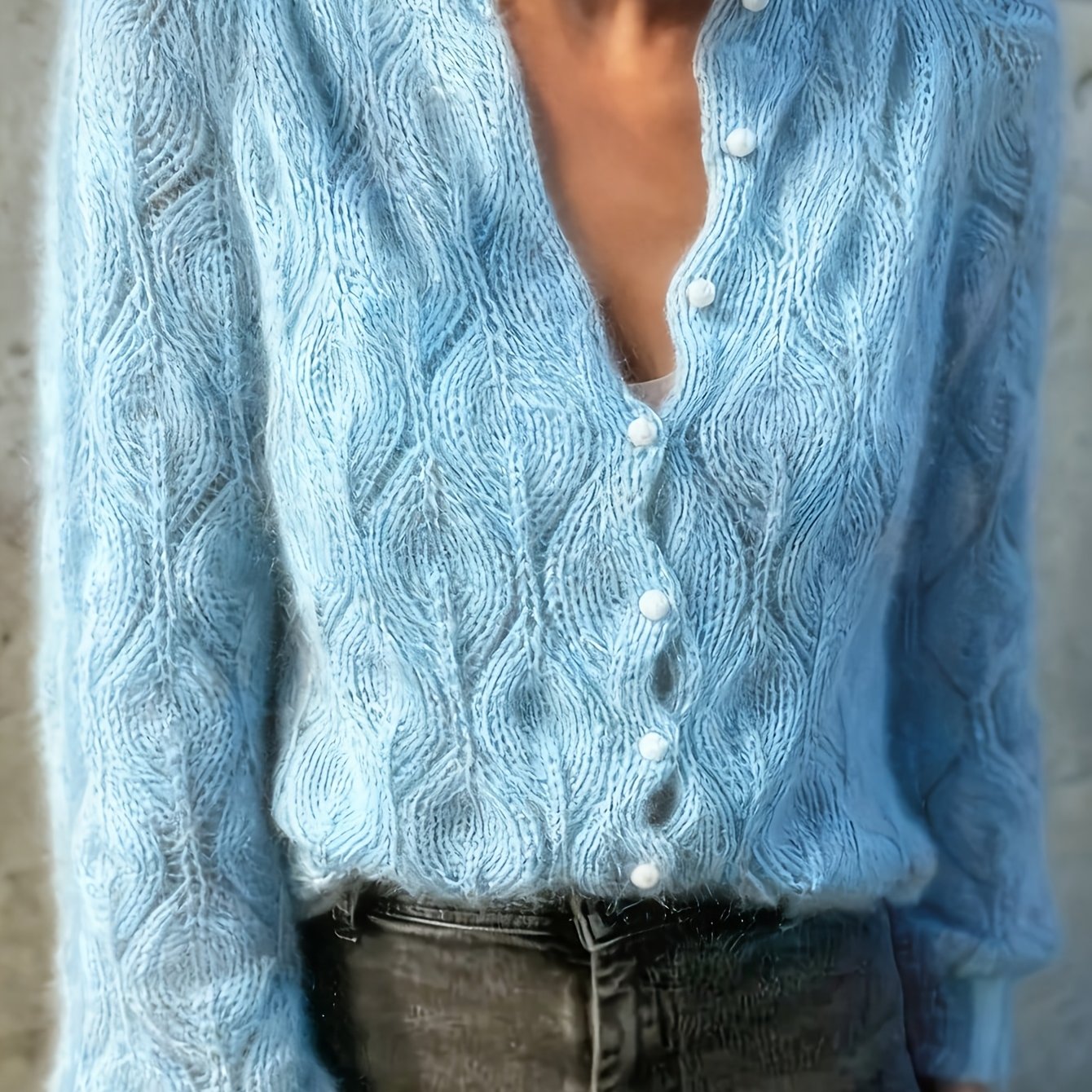 Women's long cardigan featuring a textured faux mink finish and elegant pearl buttons, designed for a relaxed fit, available in multiple colors. 0