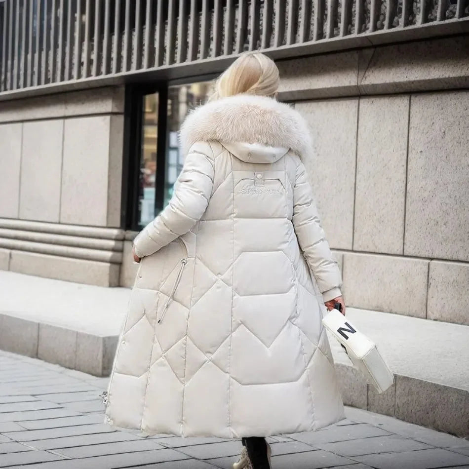 Women's long down puffer coat with high collar, designed for lightweight insulation and warmth, perfect for winter wear. 2