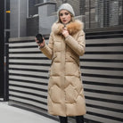 Women's long down puffer coat with high collar, designed for lightweight insulation and warmth, perfect for winter wear. 9