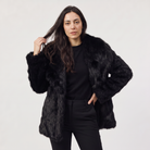 Women's longline faux fur coat featuring an oversized collar and a relaxed open-front design, perfect for stylish winter wear. 0