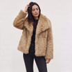 Women's longline faux fur coat featuring an oversized collar and a relaxed open-front design, perfect for stylish winter wear. 9