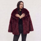 Women's longline faux fur coat featuring an oversized collar and a relaxed open-front design, perfect for stylish winter wear. 10