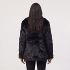 Women's longline faux fur coat featuring an oversized collar and a relaxed open-front design, perfect for stylish winter wear. 2