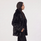 Women's longline faux fur coat featuring an oversized collar and a relaxed open-front design, perfect for stylish winter wear. 3