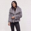 Women's longline faux fur coat featuring an oversized collar and a relaxed open-front design, perfect for stylish winter wear. 5