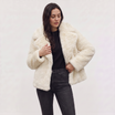 Women's longline faux fur coat featuring an oversized collar and a relaxed open-front design, perfect for stylish winter wear. 7
