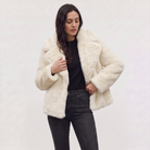 Women's longline faux fur coat featuring an oversized collar and a relaxed open-front design, perfect for stylish winter wear. 7