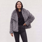 Women's longline faux fur coat featuring an oversized collar and a relaxed open-front design, perfect for stylish winter wear. 8