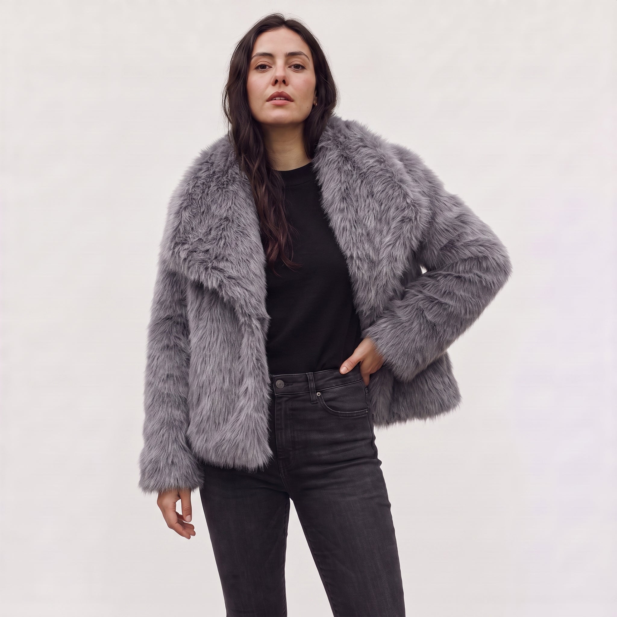 Women's longline faux fur coat featuring an oversized collar and a relaxed open-front design, perfect for stylish winter wear. 8