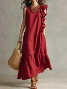 Women's sleeveless maxi dress with ruffle hem in lightweight fabric, perfect for summer boho style, featuring a flowy silhouette and vibrant colors. 1