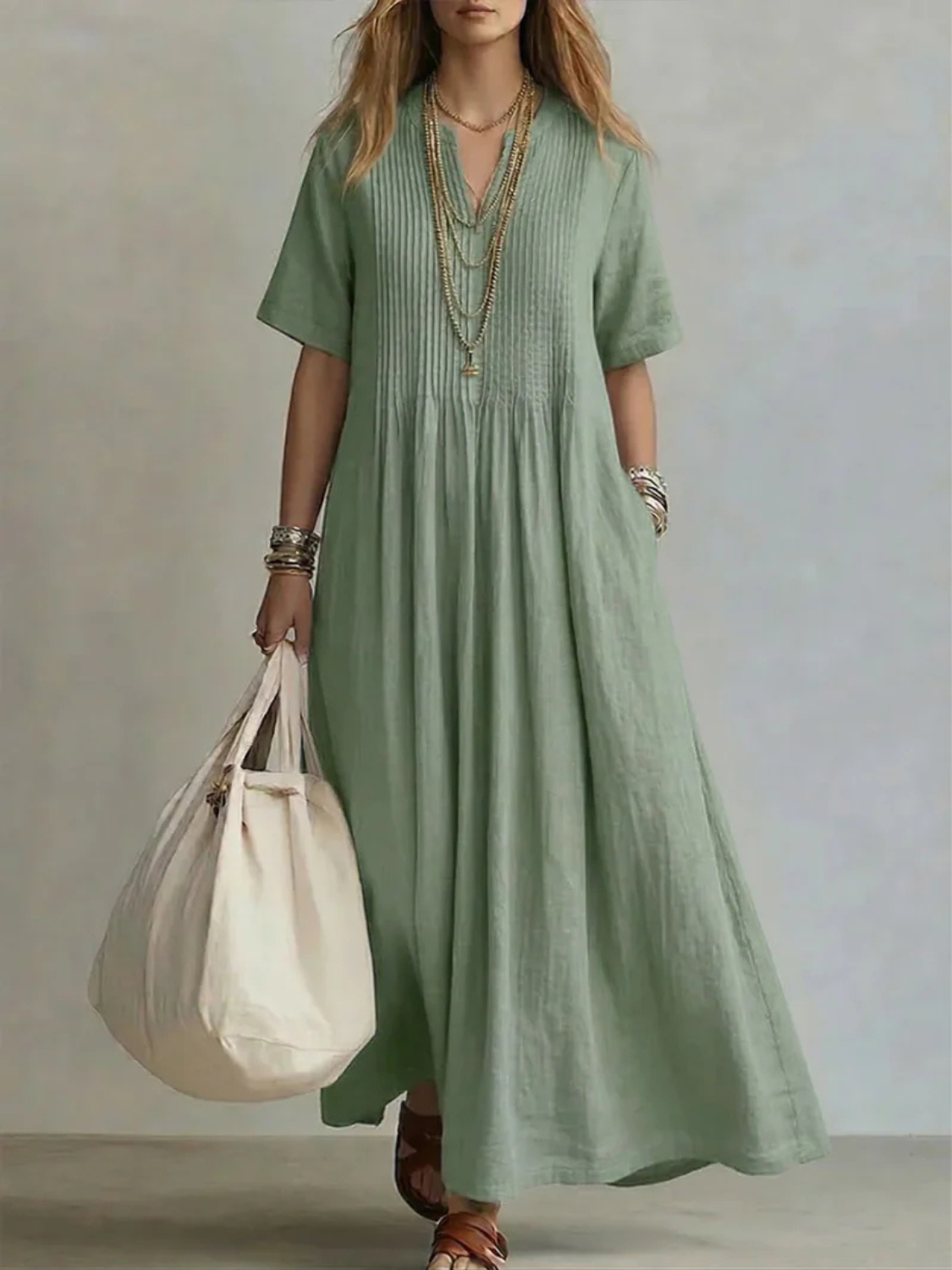 Women's maxi dress featuring a split neck and pintuck details, crafted from a breathable linen blend for ultimate summer comfort. 1