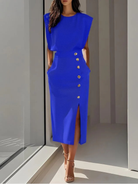 Women's midi dress featuring stylish button detail and a front slit, designed for elegance with sleeveless design and functional side pockets. 2