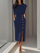 Women's midi dress featuring stylish button detail and a front slit, designed for elegance with sleeveless design and functional side pockets. 8