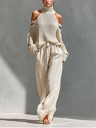 Women's outfit set featuring a beige cold-shoulder knit turtleneck top paired with wide-leg pants, showcasing a modern and comfortable style perfect for casual 0