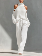 Women's outfit set featuring a beige cold-shoulder knit turtleneck top paired with wide-leg pants, showcasing a modern and comfortable style perfect for casual 3
