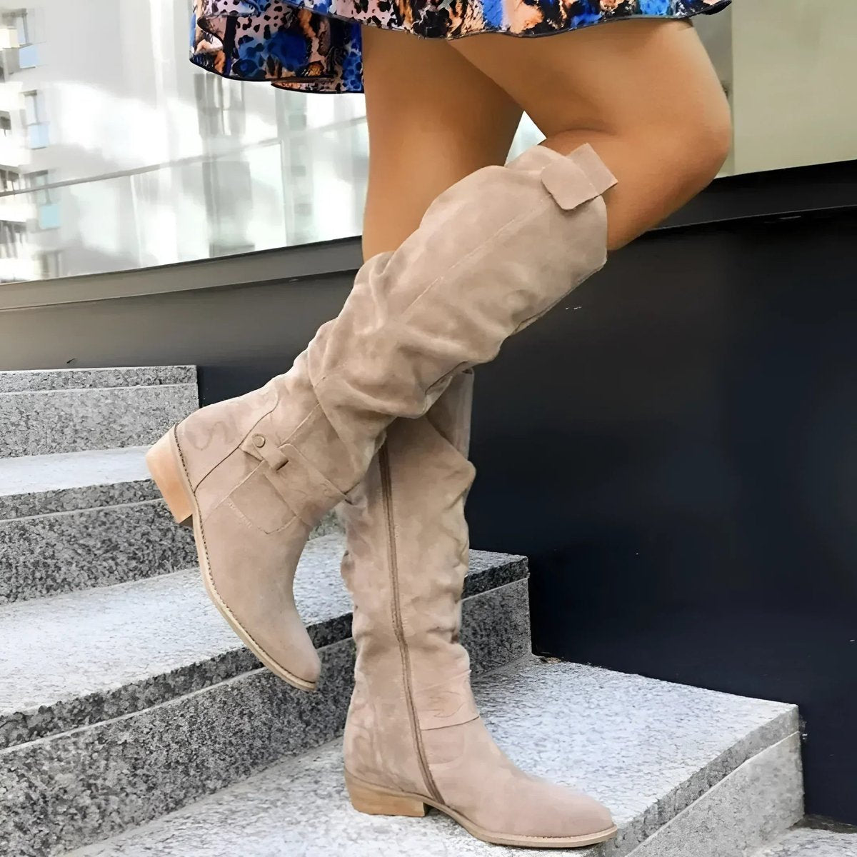Women's over-the-knee slouchy boots in soft suede featuring a side zipper and comfortable flat block heel, perfect for stylish fall and winter outfits. 0