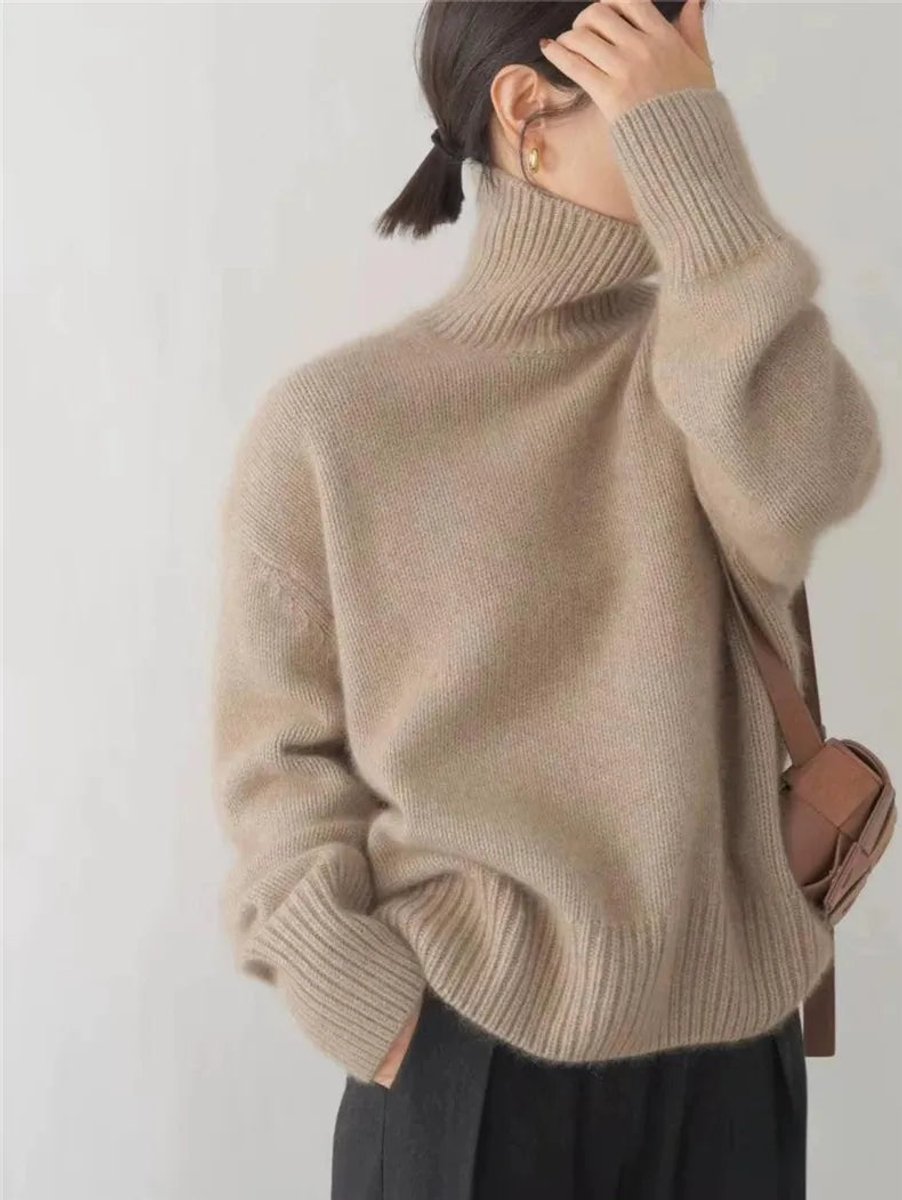 Women's oversized cashmere sweater featuring a cozy turtleneck design, crafted from soft knit fabric for ultimate comfort and warmth. 5