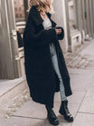 Women's oversized chunky knit cardigan featuring a longline hem and drop-shoulder design, perfect for cozy layering in cooler weather. 5