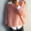 Women's oversized sweater in a soft mohair blend, perfect for cozy winter comfort with a relaxed fit and stylish knit design. 0