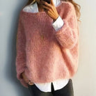 Women's oversized sweater in a soft mohair blend, perfect for cozy winter comfort with a relaxed fit and stylish knit design. 0