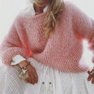 Women's oversized sweater in a soft mohair blend, perfect for cozy winter comfort with a relaxed fit and stylish knit design. 1