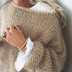 Women's oversized sweater in a soft mohair blend, perfect for cozy winter comfort with a relaxed fit and stylish knit design. 3