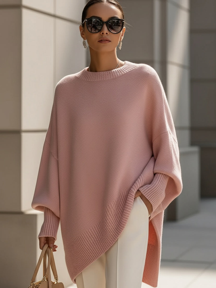 Women's oversized sweater featuring a cozy knit crew neck design and stylish asymmetrical hem, perfect for casual and comfortable outfits. 1