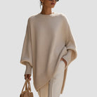 Women's oversized sweater featuring a cozy knit crew neck design and stylish asymmetrical hem, perfect for casual and comfortable outfits. 3