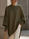 Women's oversized sweater featuring a cozy knit crew neck design and stylish asymmetrical hem, perfect for casual and comfortable outfits. 4