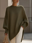 Women's oversized sweater featuring a cozy knit crew neck design and stylish asymmetrical hem, perfect for casual and comfortable outfits. 4