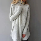 Women's oversized grey sweater featuring a chunky knit texture and high roll neck, perfect for cozy fall and winter outfits. 0