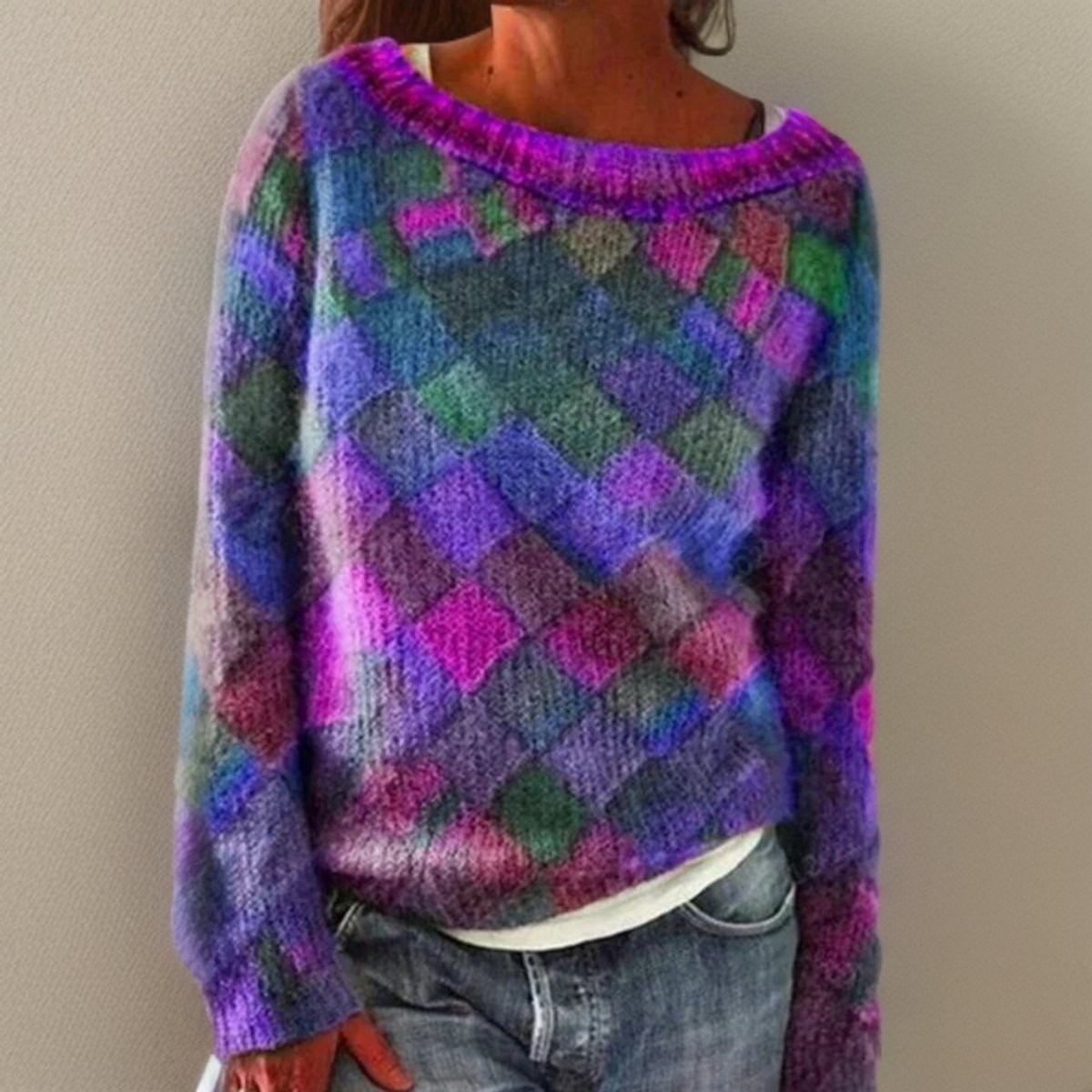 Women's oversized sweater featuring a vibrant diamond pattern, designed for a relaxed fit and comfortable knit wear. 0