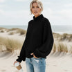 Women’s oversized sweater featuring a cozy turtleneck design, crafted from soft acrylic material, perfect for a boho chic look. Ideal for casual wear 2