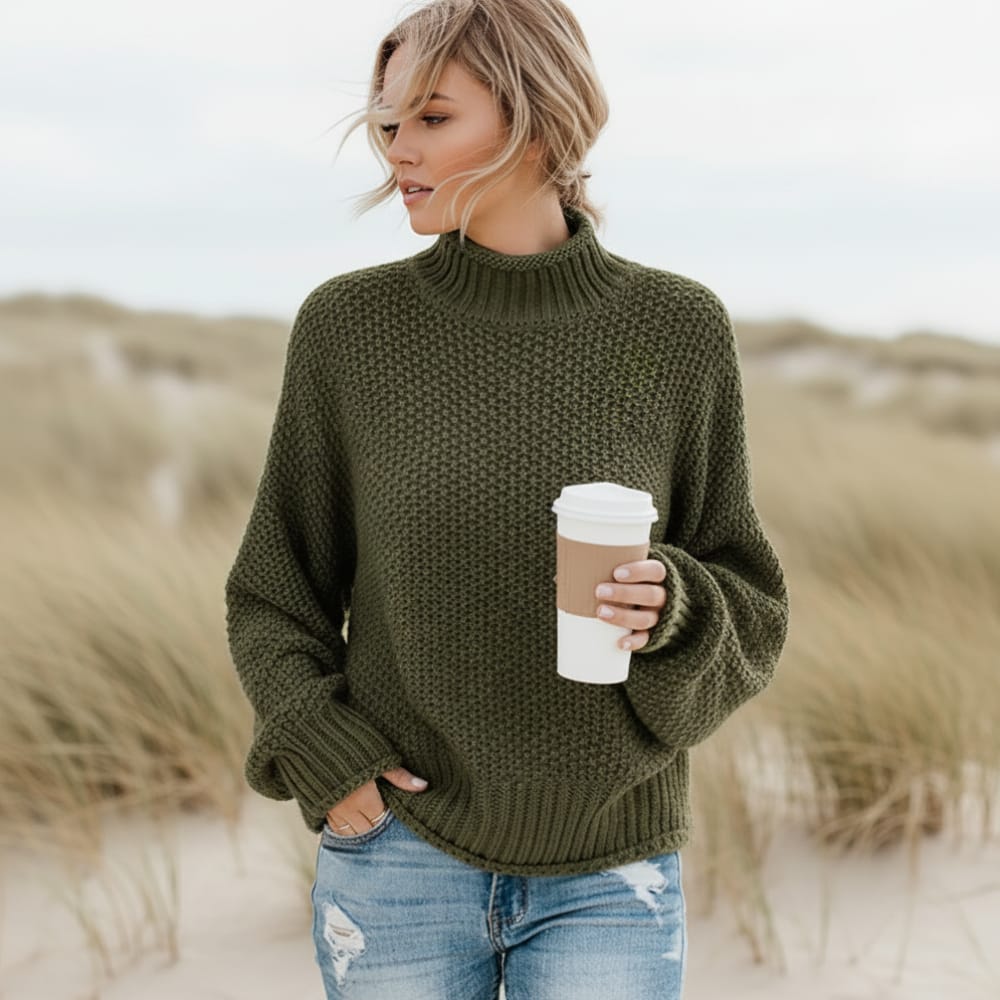 Women’s oversized sweater featuring a cozy turtleneck design, crafted from soft acrylic material, perfect for a boho chic look. Ideal for casual wear 3